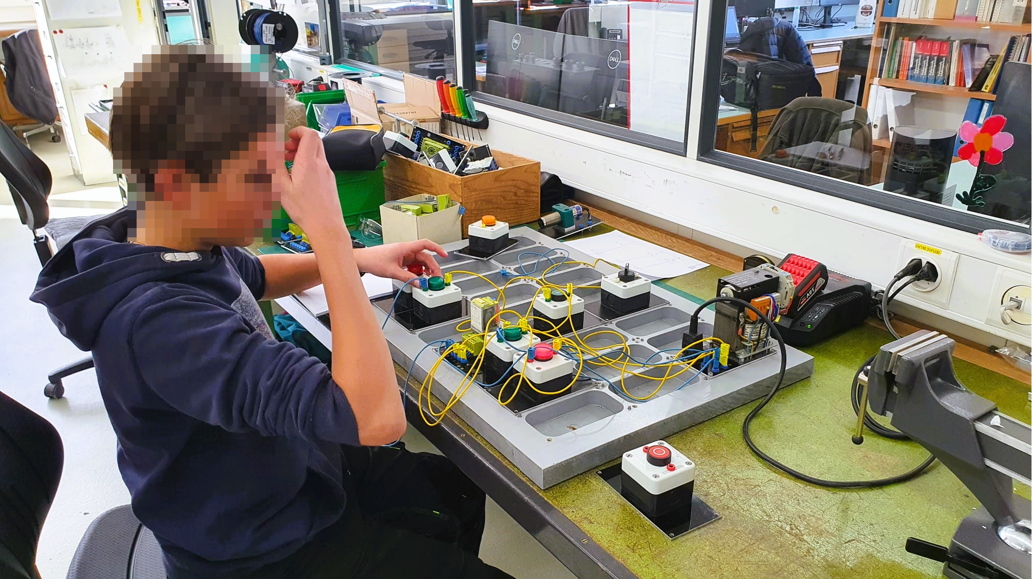 Trial apprentice working on a plug board